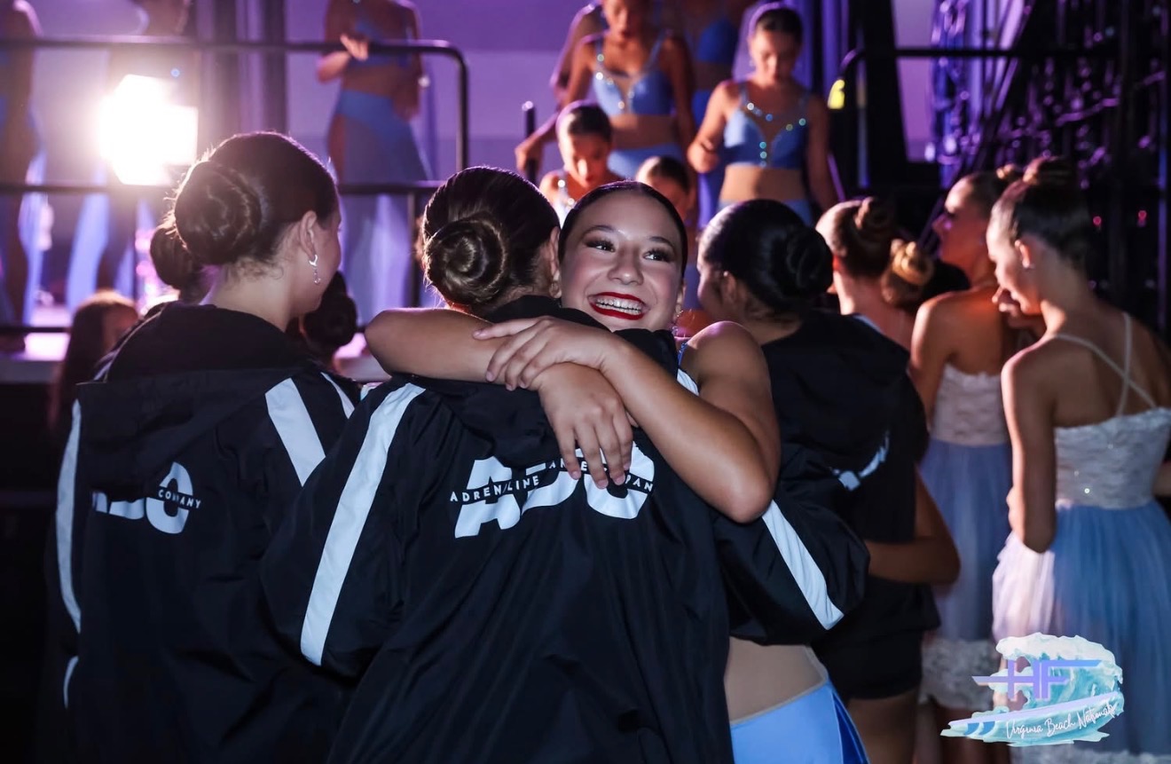 Team Pulse huddle in ADC jackets