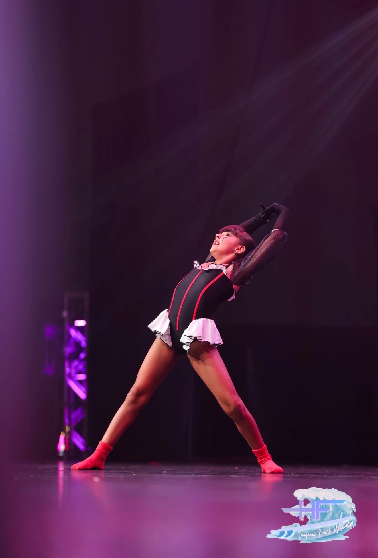 Solo performer under stage lights